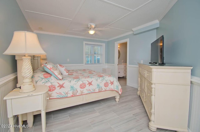 105 Wind Dance Ln, Swansboro, NC 28584 - bedroom featuring a wainscoted wall, crown molding, ensuite bathroom, and a ceiling fan
