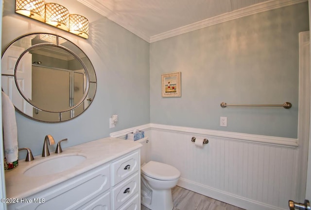 105 Wind Dance Ln, Swansboro, NC 28584 - bathroom featuring toilet, a wainscoted wall, vanity, crown molding, and a shower