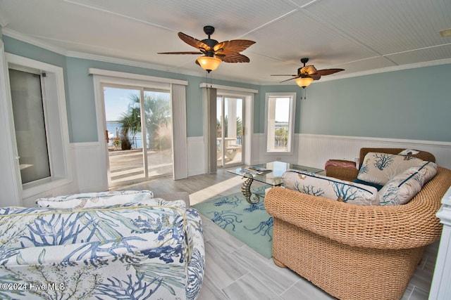 bedroom featuring ceiling fan, access to exterior, and crown molding