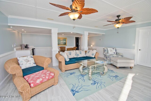 105 Wind Dance Ln, Swansboro, NC 28584 - living area featuring decorative columns, wainscoting, a ceiling fan, crown molding, and wood finished floors