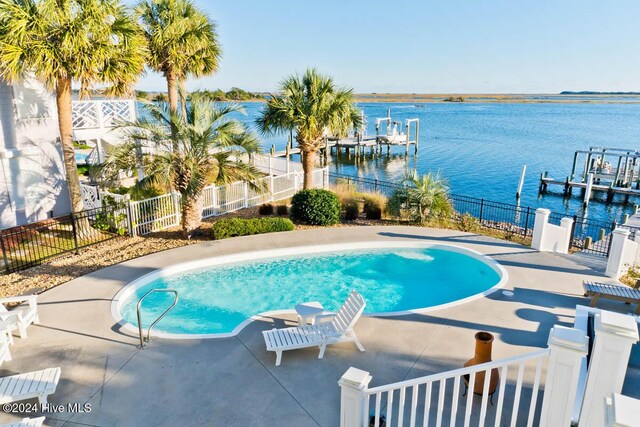 105 Wind Dance Ln, Swansboro, NC 28584 - view of pool featuring a water view, a boat dock, and a patio area