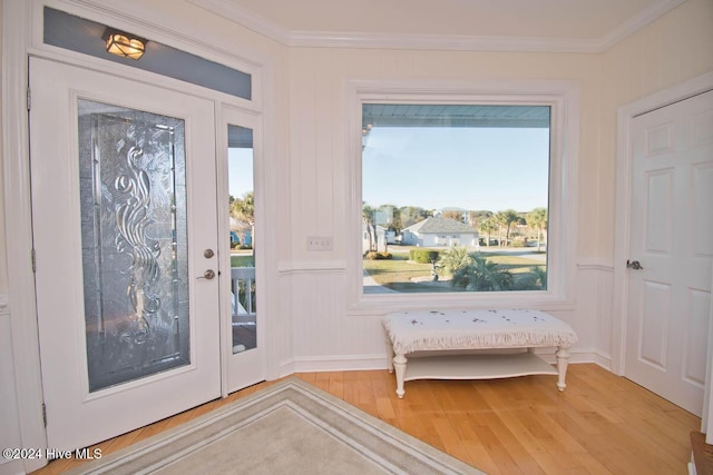 105 Wind Dance Ln, Swansboro, NC 28584 - foyer featuring wood finished floors, crown molding, a decorative wall, and plenty of natural light