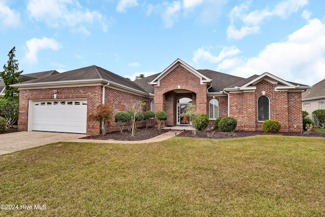 single story home featuring driveway, brick siding, and a front yard