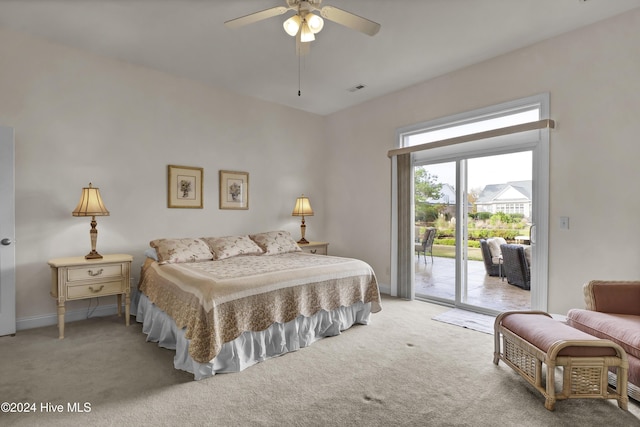 bedroom with access to outside, light colored carpet, visible vents, and baseboards