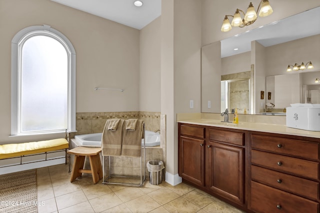 full bathroom featuring tile patterned flooring, a shower stall, vanity, and a bath