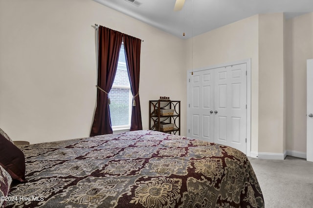 bedroom with visible vents, baseboards, a ceiling fan, carpet flooring, and a closet