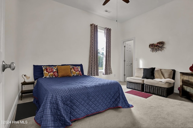 bedroom featuring carpet floors, visible vents, baseboards, and a ceiling fan