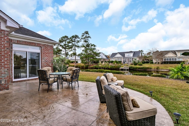 view of patio with a residential view and outdoor dining area