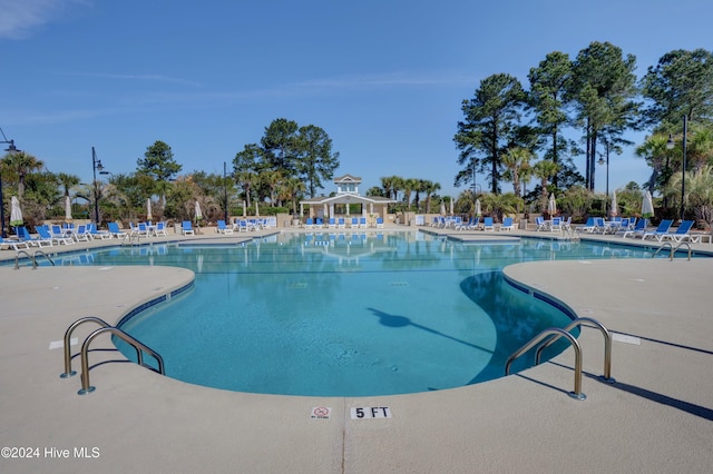 community pool featuring a gazebo