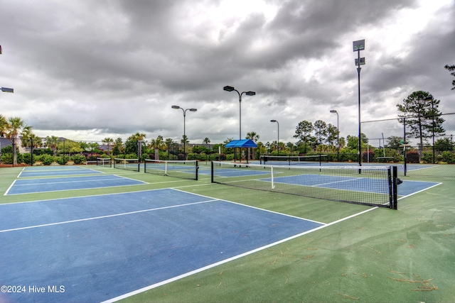 view of sport court featuring fence