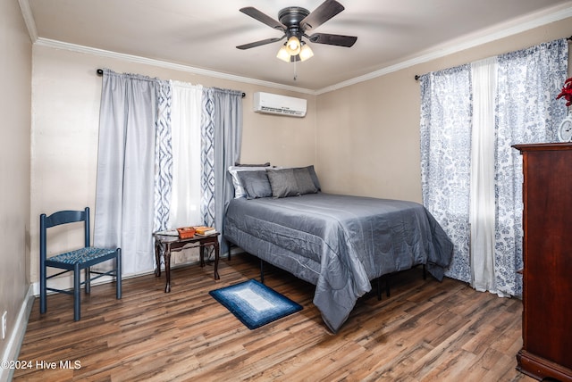 bedroom with wood-type flooring, an AC wall unit, ceiling fan, and crown molding