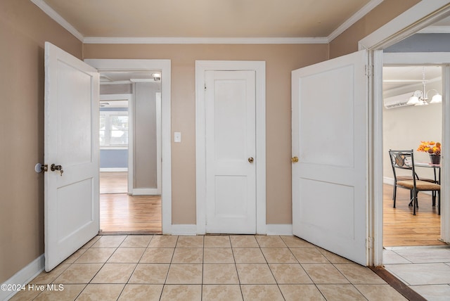 bedroom featuring light hardwood / wood-style floors, a notable chandelier, and ornamental molding