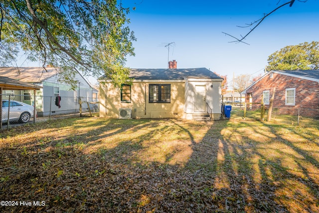 back of house with a yard