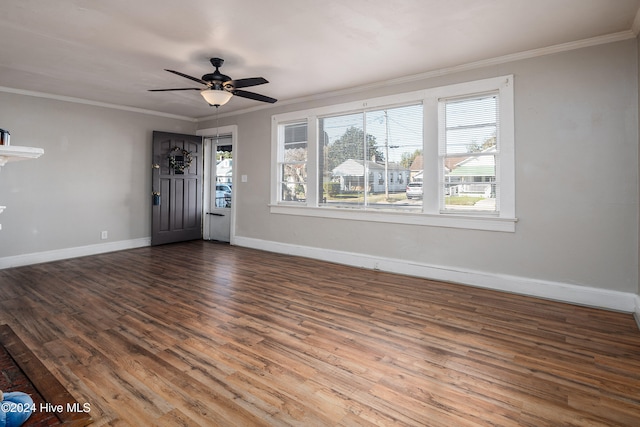 interior space with ceiling fan, wood-type flooring, and ornamental molding