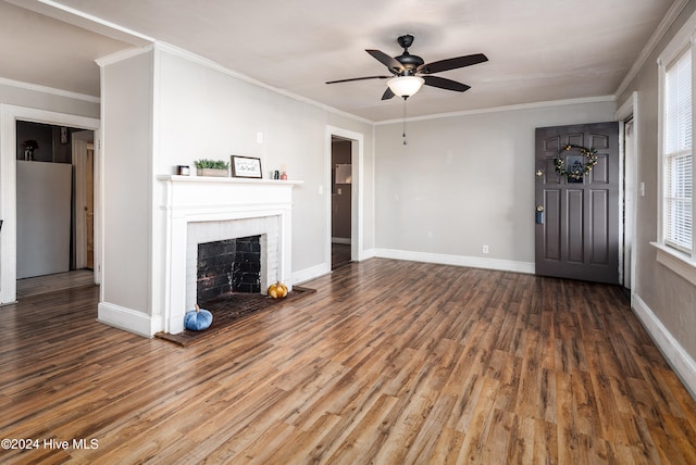 unfurnished living room with a brick fireplace, ceiling fan, hardwood / wood-style floors, and ornamental molding