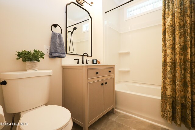 full bathroom featuring tile patterned flooring, vanity, shower / bath combo, and toilet