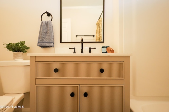 full bathroom featuring plus walk in shower, vanity, toilet, and ornamental molding