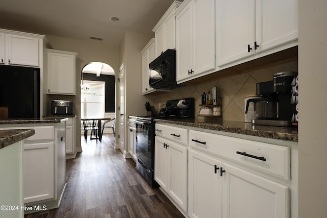 kitchen with backsplash, dark hardwood / wood-style flooring, white cabinets, and black appliances