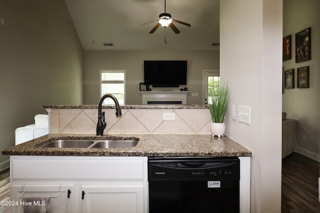 kitchen with dishwasher, sink, dark hardwood / wood-style floors, dark stone countertops, and white cabinetry