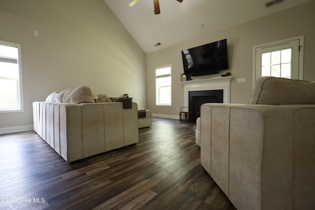 living room featuring ceiling fan, dark hardwood / wood-style flooring, and high vaulted ceiling