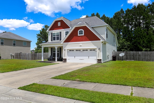 craftsman-style house with a garage and a front lawn