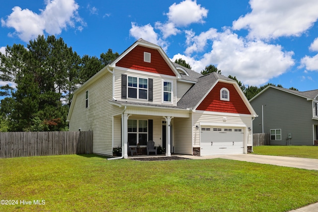 craftsman inspired home featuring a garage, covered porch, and a front yard