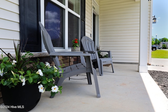 view of patio featuring a porch