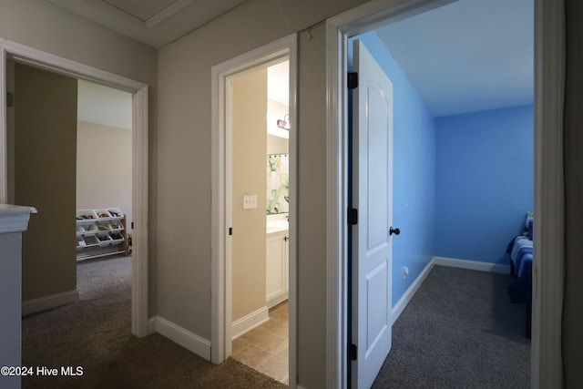 corridor with carpet floors