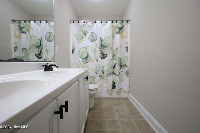 full bathroom with shower / bath combination with curtain, vanity, toilet, and tile patterned floors