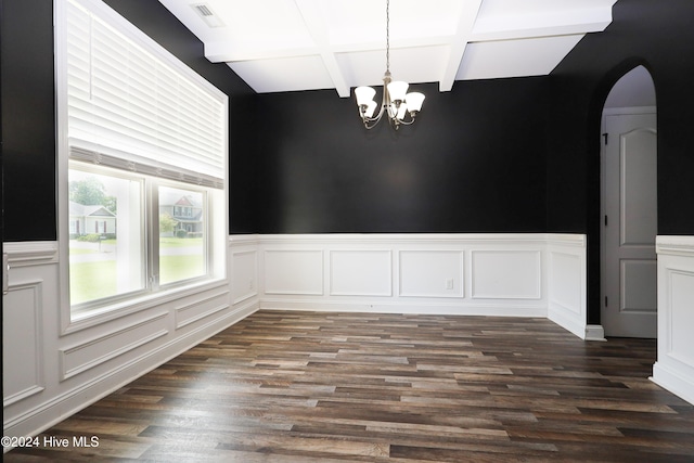 unfurnished dining area with beamed ceiling, a chandelier, and dark hardwood / wood-style floors