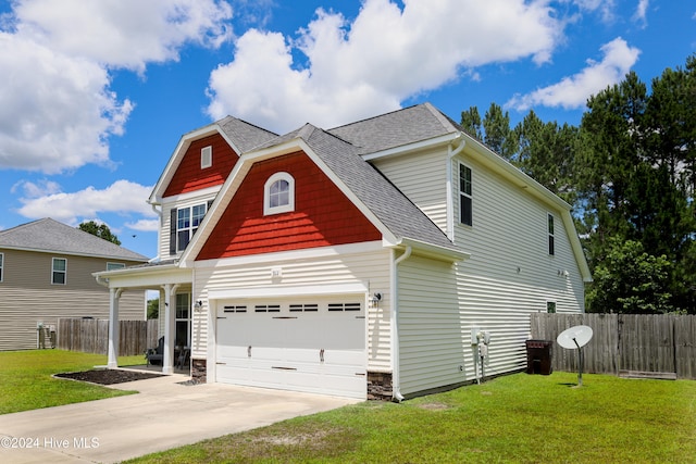 view of front facade with a garage and a front yard