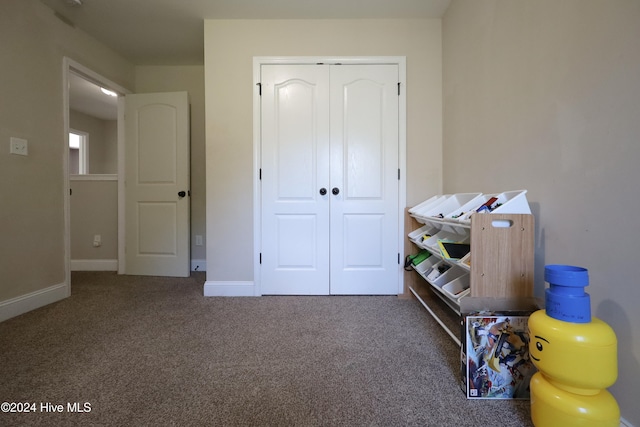 carpeted bedroom featuring a closet