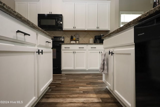 kitchen featuring dark hardwood / wood-style floors, dark stone counters, decorative backsplash, white cabinets, and black appliances