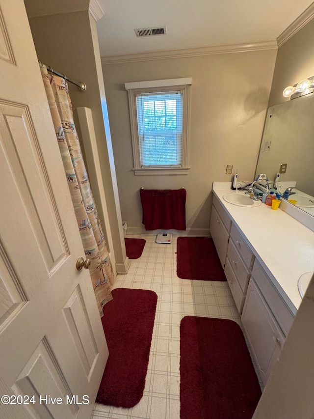 bathroom featuring vanity and crown molding