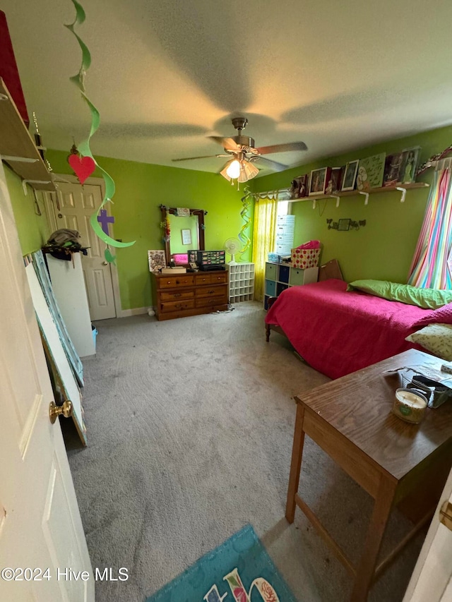 carpeted bedroom featuring ceiling fan