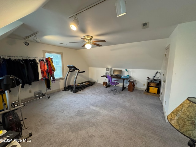 workout area featuring ceiling fan, light colored carpet, and lofted ceiling