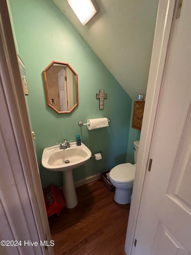 bathroom with sink, wood-type flooring, and toilet