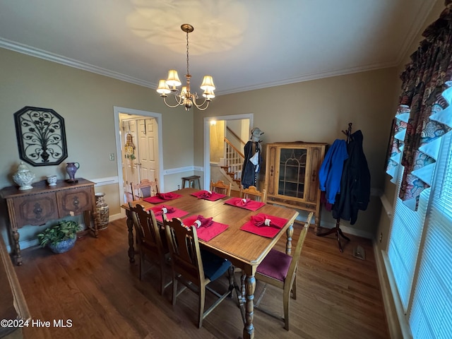 dining space featuring an inviting chandelier, dark wood-type flooring, and ornamental molding