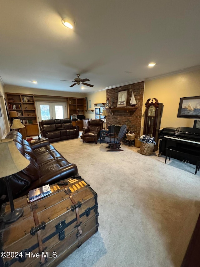 living room with a fireplace, carpet floors, ceiling fan, and ornamental molding