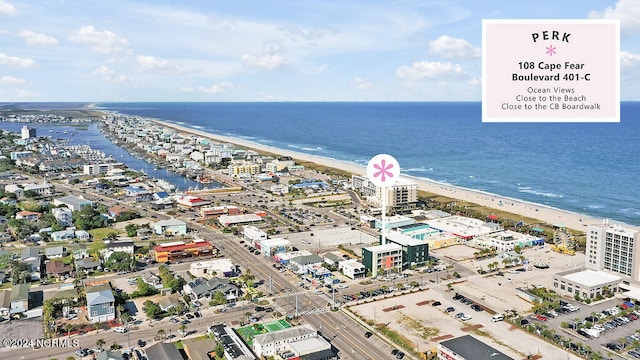 aerial view with a water view and a view of the beach