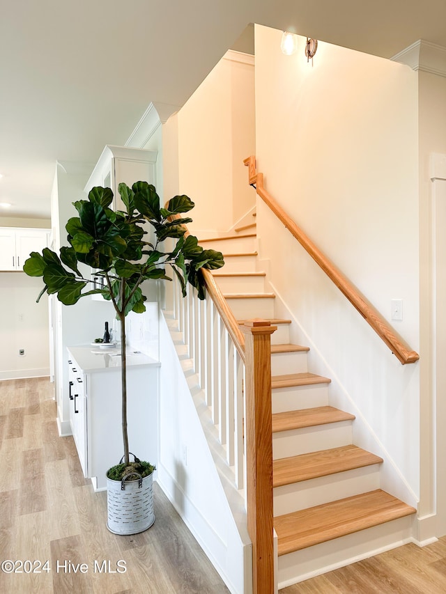 staircase featuring hardwood / wood-style flooring