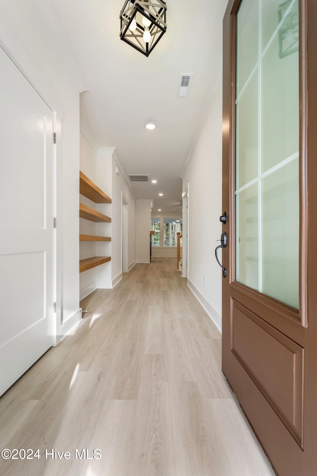 hall with light hardwood / wood-style flooring