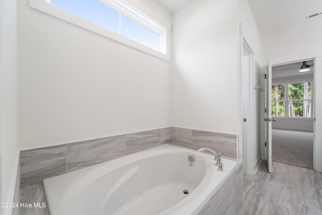 bathroom with tiled tub