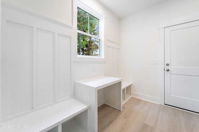 mudroom with light hardwood / wood-style floors