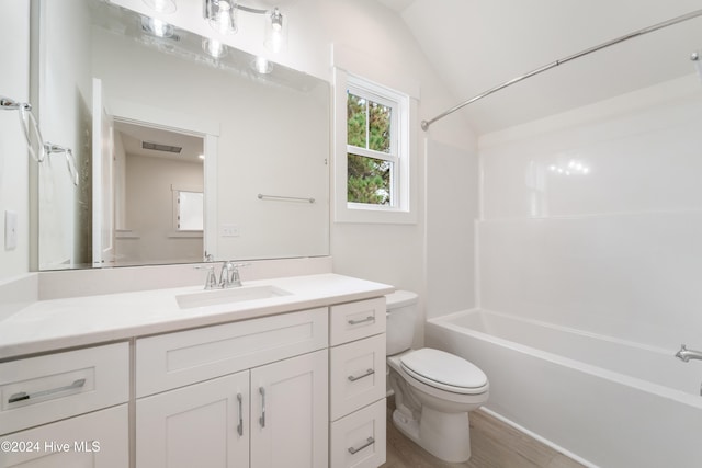 full bathroom with lofted ceiling, vanity, toilet, and shower / bathtub combination