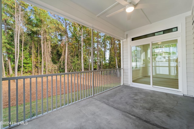 unfurnished sunroom with ceiling fan