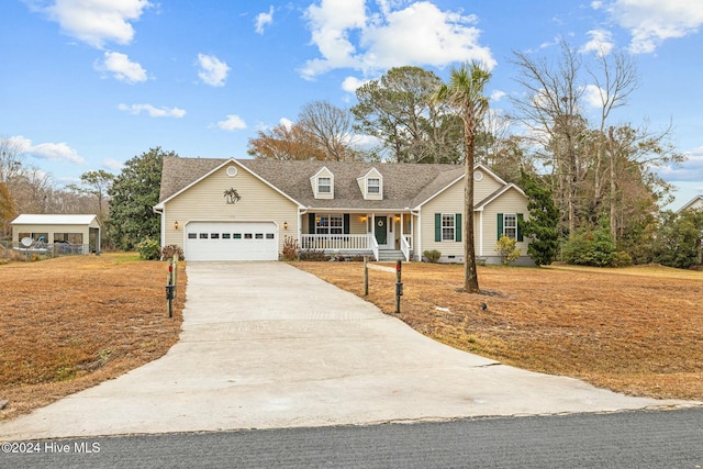 view of front of house featuring a porch and a garage