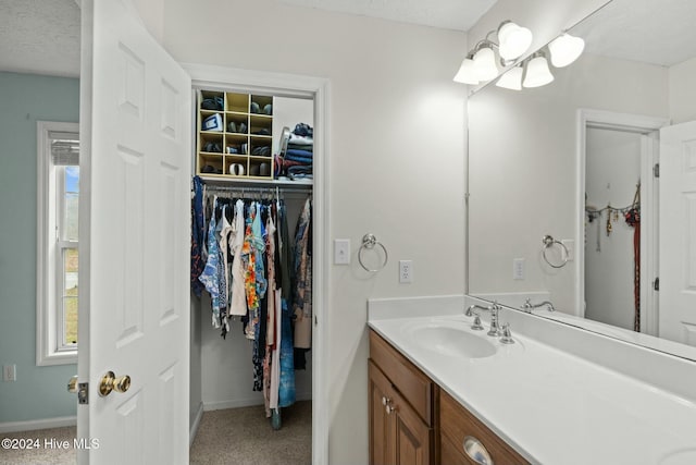 bathroom featuring vanity and a textured ceiling