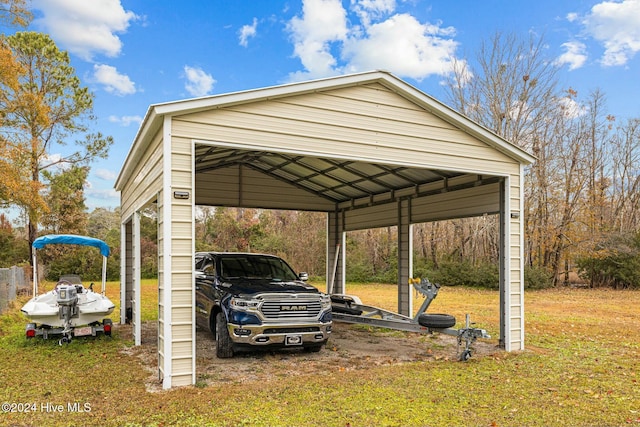 view of car parking with a carport and a lawn