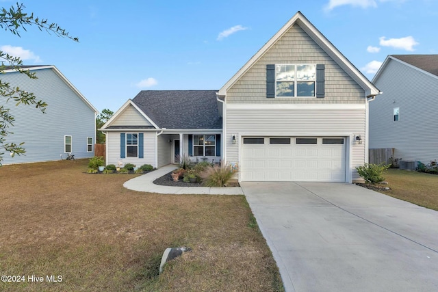 front of property with central AC unit, a garage, and a front lawn